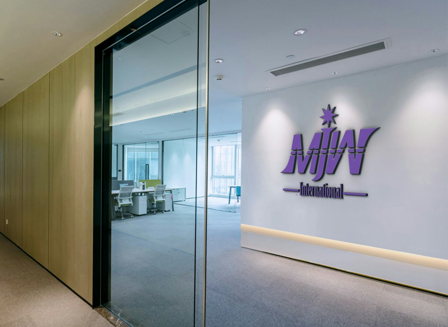 Logo 3D berwarna ungu tergantung di dinding kantor modern.